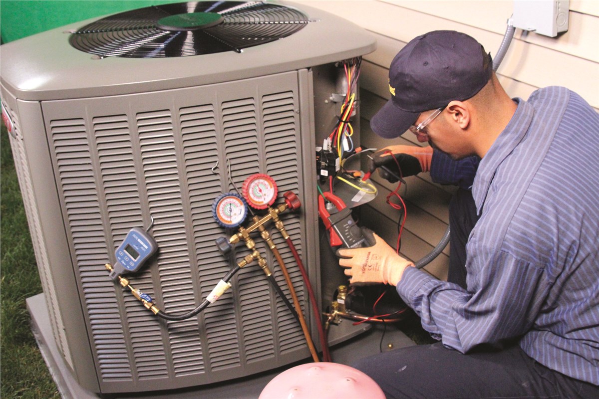 HVAC technician testing an outdoor air conditioning unit in Glendale